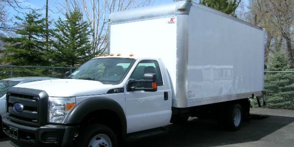 White truck with enclosed bed